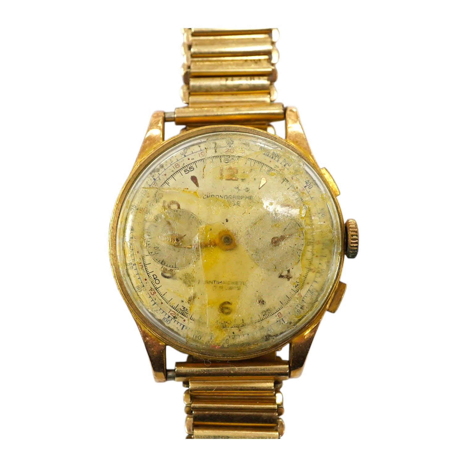 A gentleman's yellow metal Swiss chronograph manual wind wrist watch (lacking back cover), on a gold plated strap. Condition - poor.